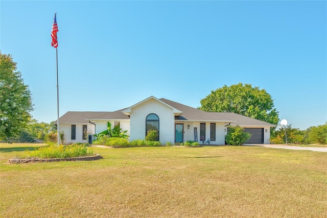 ranch-style house with a garage and a front yard