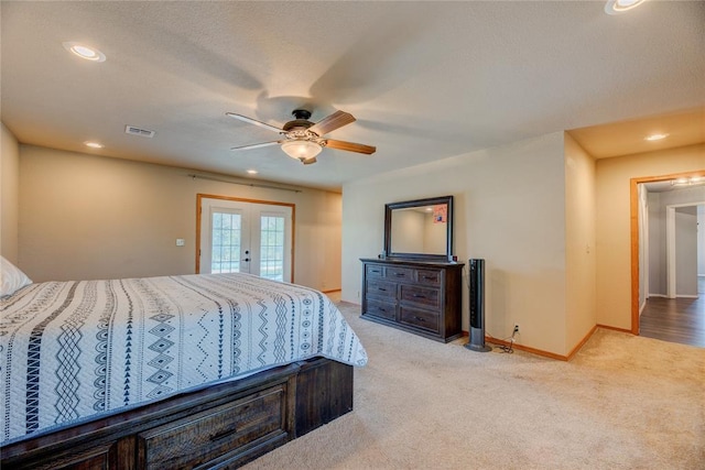 carpeted bedroom featuring access to outside, french doors, and ceiling fan