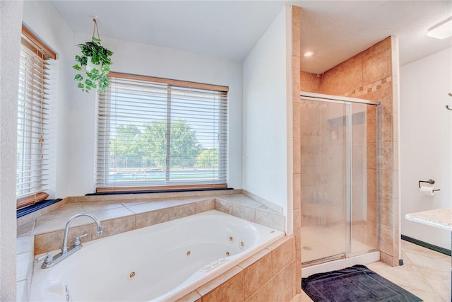 bathroom with shower with separate bathtub