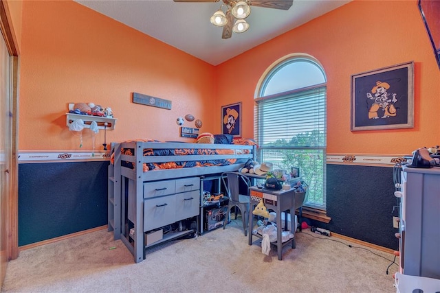 bedroom featuring ceiling fan and light carpet