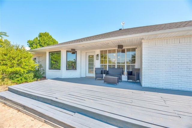 wooden deck with outdoor lounge area