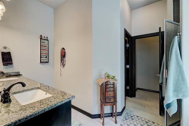 bathroom with vanity and wood-type flooring