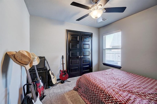 bedroom with ceiling fan and carpet floors