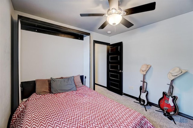 bedroom featuring light colored carpet and ceiling fan