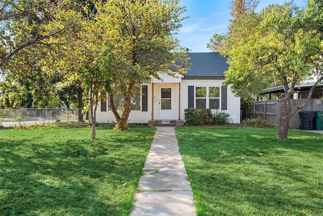 obstructed view of property featuring a front yard