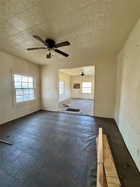 unfurnished room with ceiling fan