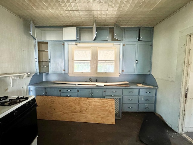 kitchen featuring sink and white range with gas stovetop