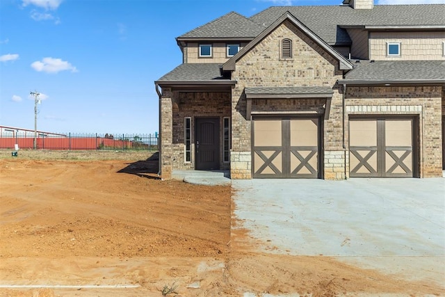 view of front of property featuring a garage