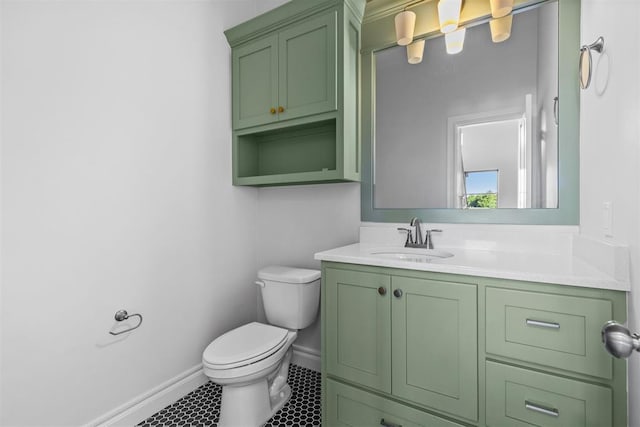 bathroom with tile patterned floors, vanity, and toilet