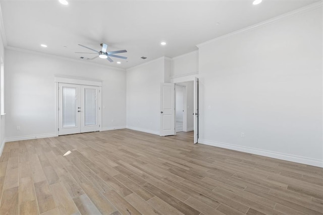 spare room featuring crown molding, ceiling fan, and light wood-type flooring