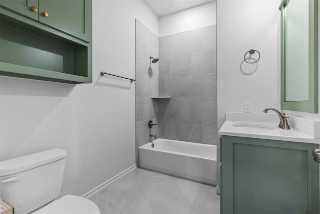 full bathroom featuring tile patterned flooring, vanity, tiled shower / bath combo, and toilet