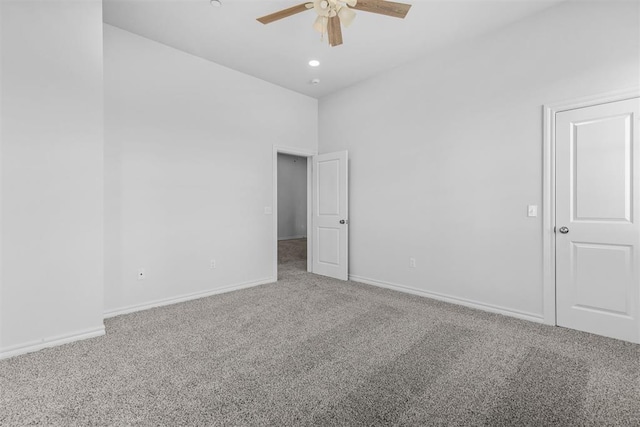 unfurnished room with carpet and ceiling fan