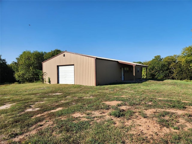 exterior space featuring a yard and a garage