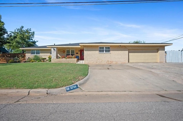 ranch-style home with a front lawn and a garage