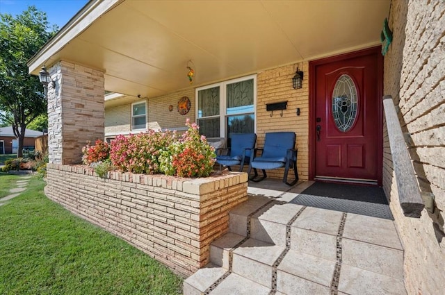 property entrance featuring a porch