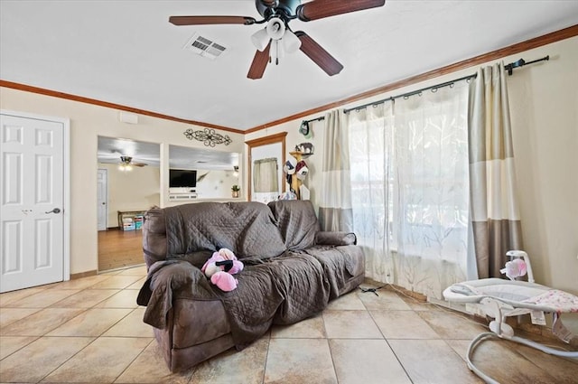 tiled living room with ceiling fan and ornamental molding