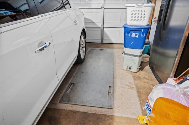 garage featuring stainless steel refrigerator