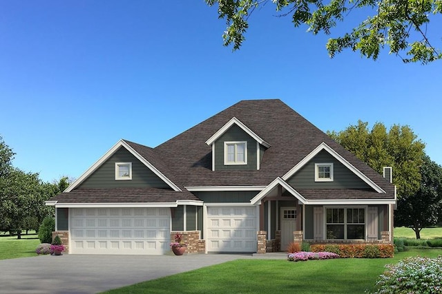 craftsman house with a shingled roof, a front yard, and driveway