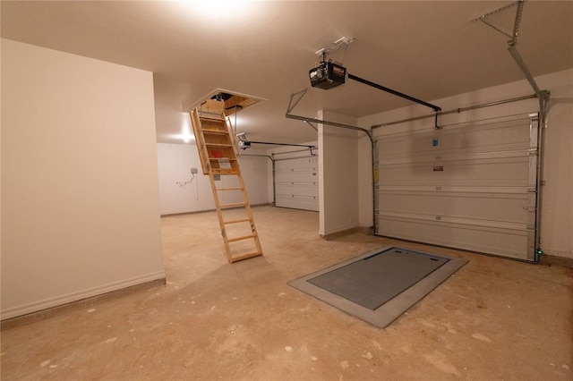 garage featuring baseboards and a garage door opener