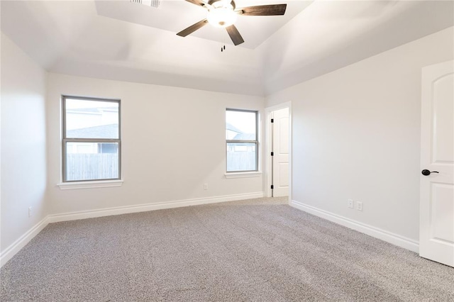 unfurnished room with carpet flooring, ceiling fan, and baseboards