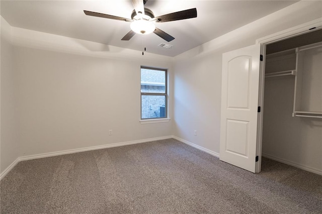 unfurnished bedroom featuring carpet, a closet, visible vents, a ceiling fan, and baseboards