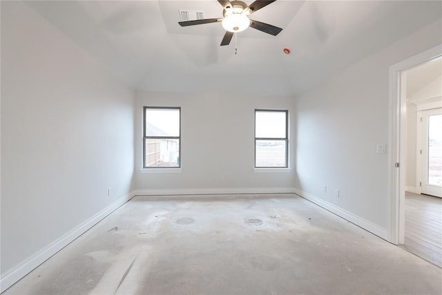 unfurnished room featuring visible vents, a ceiling fan, baseboards, and concrete floors