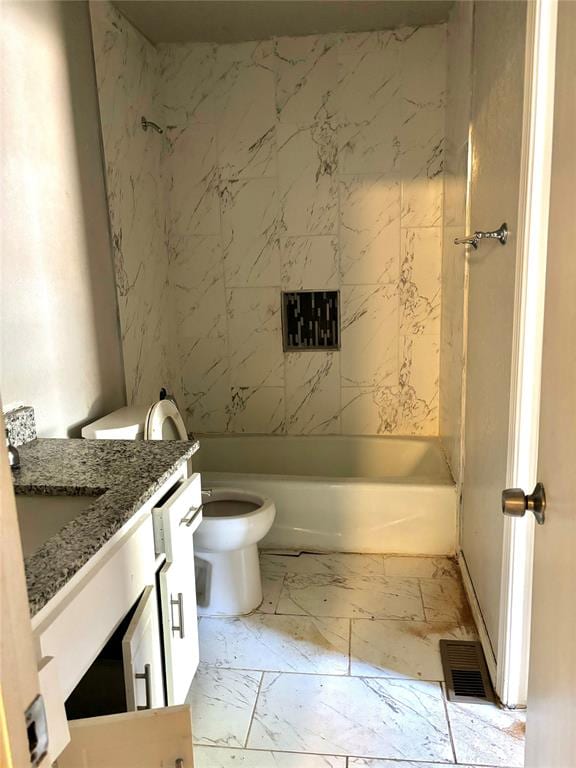 full bathroom featuring vanity, toilet, and washtub / shower combination