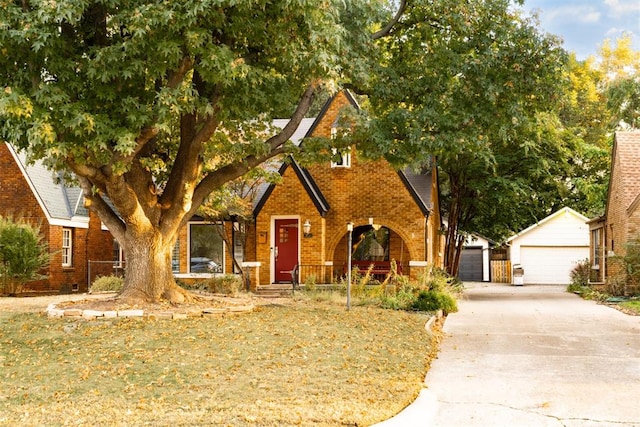 view of front of property with a garage and an outdoor structure