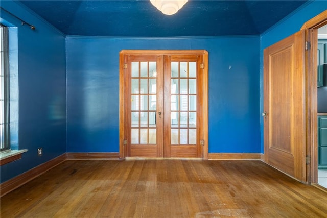 interior space with a healthy amount of sunlight, french doors, and wood-type flooring