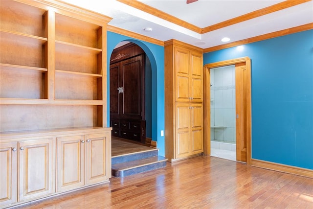 spare room with light hardwood / wood-style flooring and ornamental molding