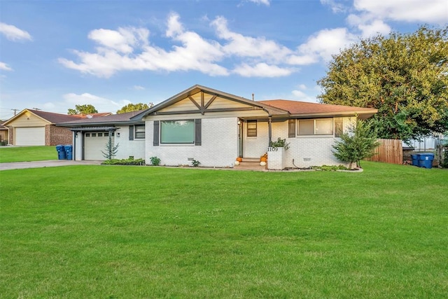 ranch-style house featuring a garage and a front yard