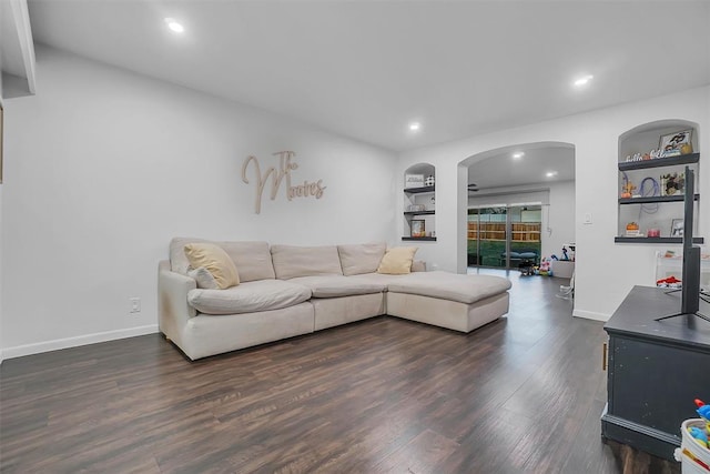 living room featuring dark wood-type flooring