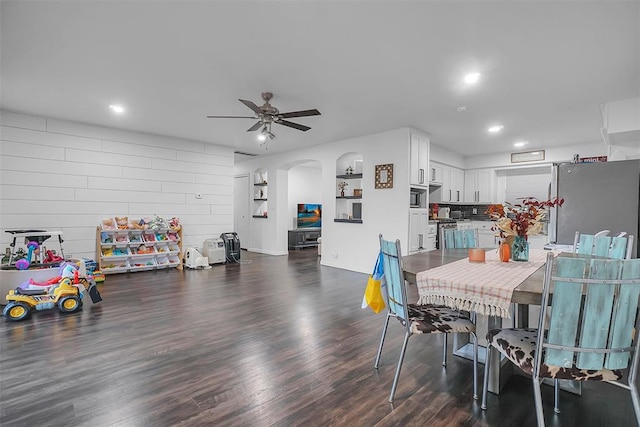 dining room featuring dark hardwood / wood-style flooring and ceiling fan