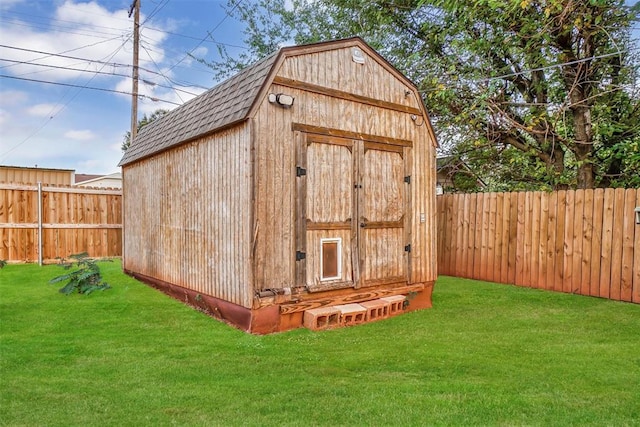 view of outdoor structure featuring a lawn