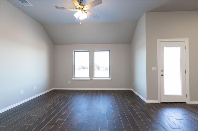 bonus room with a ceiling fan, visible vents, vaulted ceiling, and dark wood-type flooring