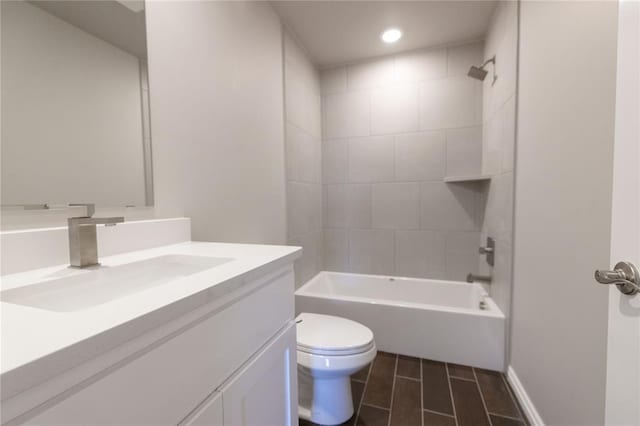 bathroom featuring toilet, recessed lighting, washtub / shower combination, and vanity