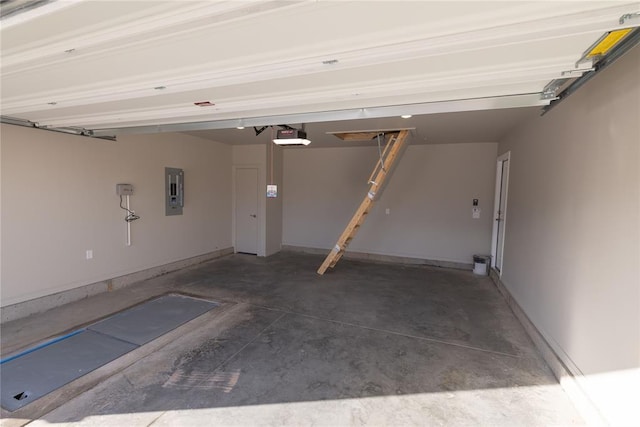 garage featuring electric panel and a garage door opener