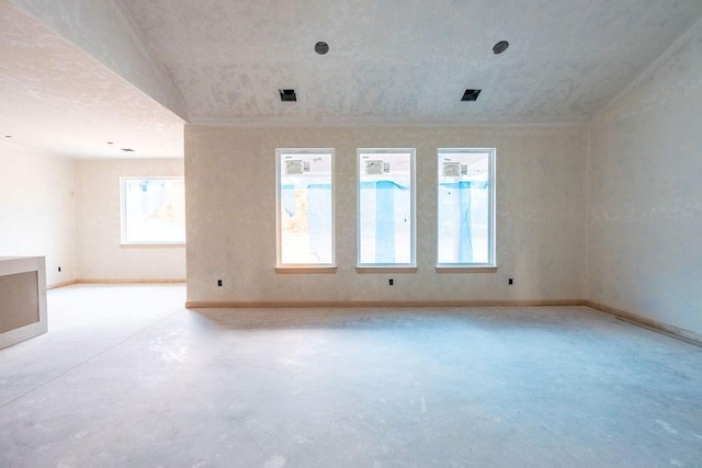 spare room featuring vaulted ceiling