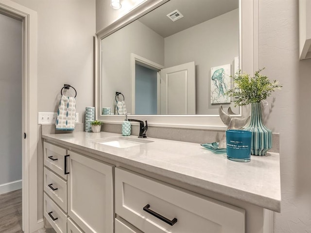 bathroom featuring vanity and wood-type flooring