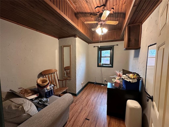 office featuring ceiling fan, light hardwood / wood-style floors, and wood ceiling