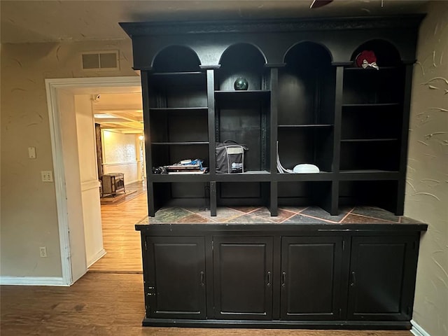 bar featuring hardwood / wood-style floors