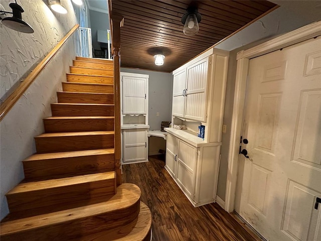 interior space featuring wood ceiling and dark wood-type flooring