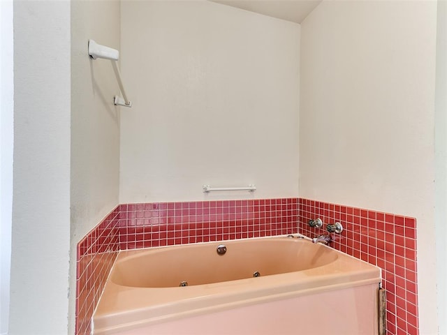 bathroom featuring a tub to relax in