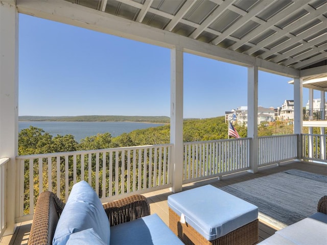 exterior space with an outdoor living space and a water view