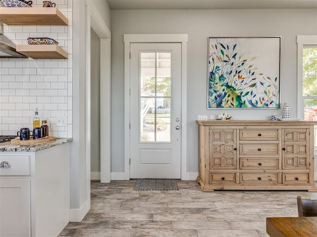 doorway to outside with light hardwood / wood-style flooring