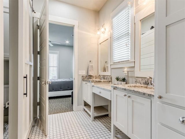 bathroom featuring tile patterned flooring and vanity