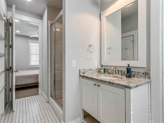 bathroom featuring vanity, tile patterned floors, and walk in shower