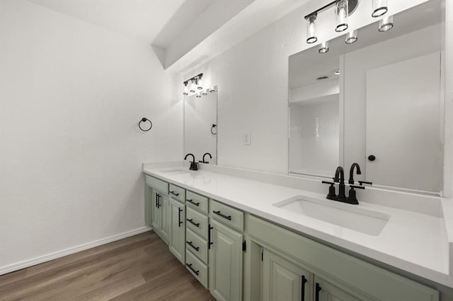 bathroom with hardwood / wood-style floors and vanity