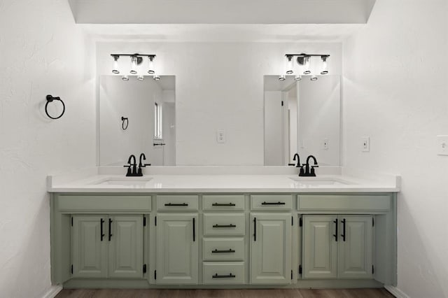 bathroom with hardwood / wood-style floors and vanity