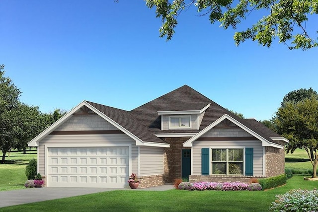 view of front of property with a front yard and a garage